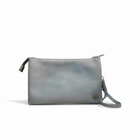Blue and grey Claire Flowers crossbody bag with wristlet strap, featuring a sleek compact silhouette and versatile convertible design for everyday wear and evening styling.
