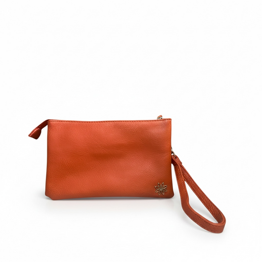 Orange Claire Flowers convertible crossbody and wristlet bag with a structured silhouette, gold hardware, and detachable strap, measuring approximately 9 x 6 x 2 inches. Features a zip-top closure and signature striped interior lining with one zip pocket and two open pockets, designed for everyday essentials and effortless day-to-night wear.